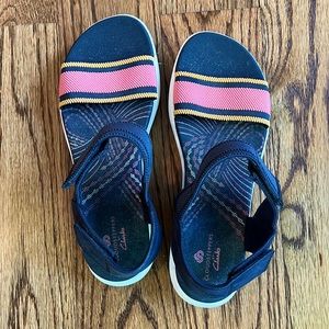 Clarks sandals with Velcro closures and elastic striped band at toes!